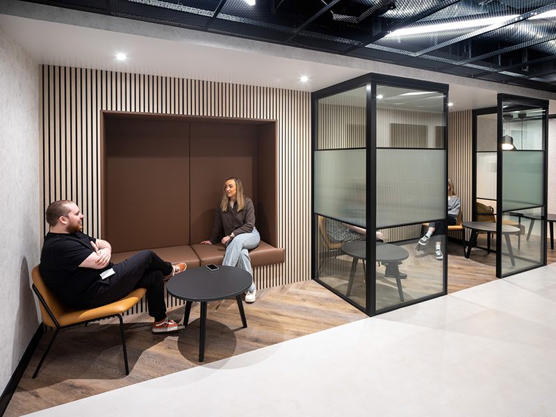 the image shows an example of neuroinclusive workplace design with choices of working spaces